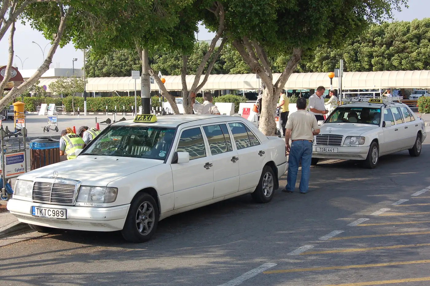 A row of taxis waiting outside the terminal at Larnaca International Airport
