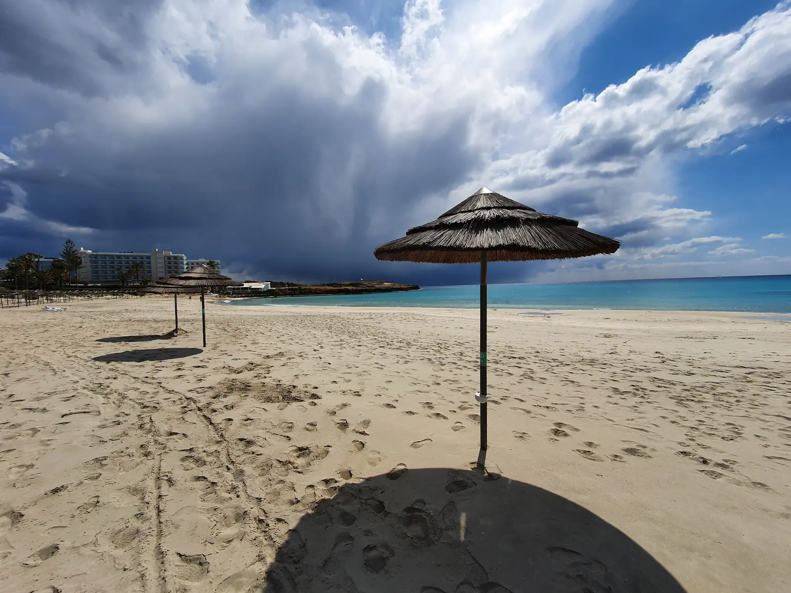 Sandy Nissi Beach near Ayia Napa with a straw parasol
