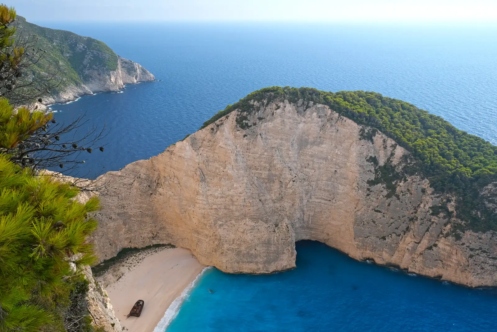 Navagio Shipwreck Beach and its turquoise cove seen from the clifftop viewpoint on Zakynthos